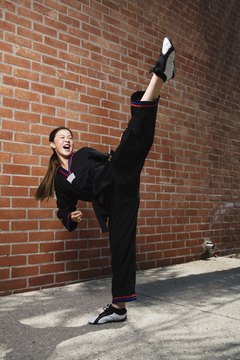 Jupiterimages/Brand X Pictures/Getty Images High kicks are an effective technique often used in taekwondo sparring.