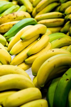 Jupiterimages/Photos.com/Getty Images Fruit fly eggs and larvae often enter a home on banana skins.