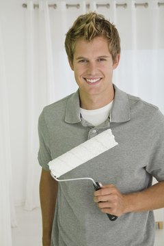 Jupiterimages/Goodshoot/Getty Images Satisfy your house painter by offering him a tip for his exceptional services.