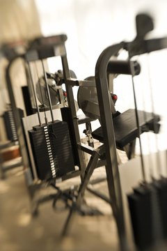 Thinkstock/Comstock/Getty Images Using weight machines help you to isolate specific muscles and learn proper form.