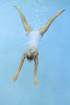 Goodshoot/Goodshoot/Getty Images The breaststroke is a slow stroke that focuses more on your legs.