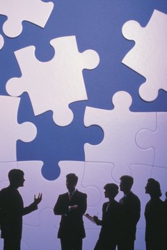 Comstock/Comstock/Getty Images Cohesiveness in the workplace makes for more productive teams.