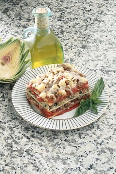 Ablestock.com/AbleStock.com/Getty Images Use olive oil in your dishes instead of butter and other saturated fats.