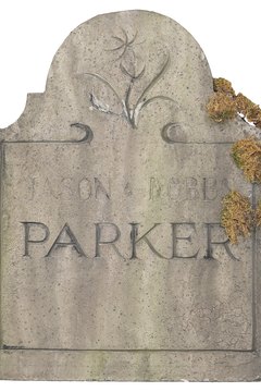 A fading headstone name evokes the history of a time and family.
