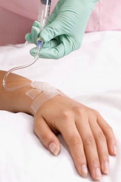 ICU nurses check IVs and monitor medication.