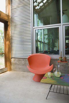 Jupiterimages/Comstock/Getty Images South-facing windows and a cement floor absorb and retain solar energy for home heating.