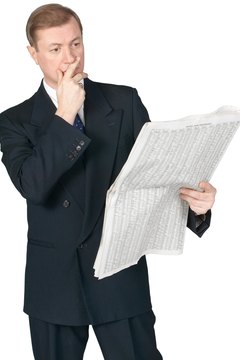 Hemera Technologies/PhotoObjects.net/Getty Images Reading the daily financial news will help you construct your portfolio.