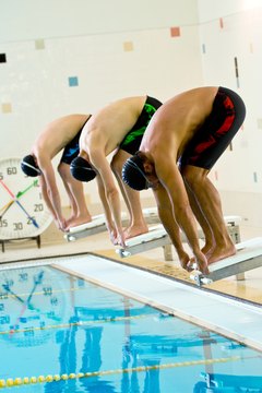 Jupiterimages/Photos.com/Getty Images FINA-approved tech suit benefits include drag reduction.