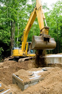 Jupiterimages/Photos.com/Getty Images Managing waste water, especially for homes with a septic tank like this one, is important for eco-friendly building.