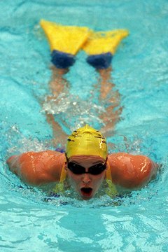 Mark Dadswell/Getty Images Sport/Getty Images Burn extra calories by adding few laps of the butterfly with fins.
