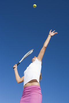 Polka Dot Images/Polka Dot/Getty Images Playing tennis can help you shed pounds.