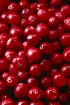 Brand X Pictures/Brand X Pictures/Getty Images Cranberry juice and supplements each have benefits.