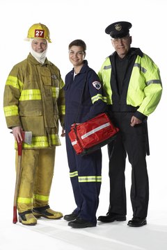 NA/Photos.com/Getty Images EMTs often work closely with firefighters and police officers.