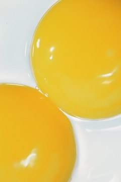 Comstock/Comstock/Getty Images Raw egg yolk is fine. Egg whites, not so much.