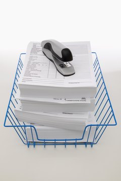 Jupiterimages/liquidlibrary/Getty Images Keeping track of contribution limits is an annual challenge for employees.