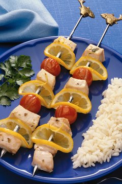 Jupiterimages/Photos.com/Getty Images Rice, lean protein-rich foods and certain fruits and vegetables can help ease gassiness.