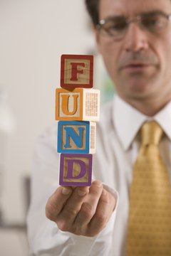 Comstock Images/Comstock/Getty Images You should review and change your funds as you age.