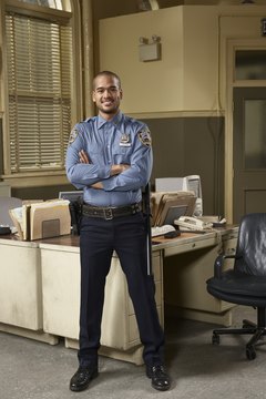 Young policeman in office, portrait