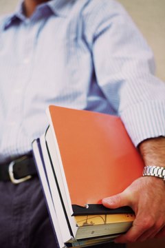 Brand X Pictures/Brand X Pictures/Getty Images Many scholarship and grant programs are available to assist married men with paying college tuition.