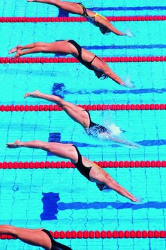 Digital Vision./Digital Vision/Getty Images The underwater dolphin kick can help propel you faster during a race.