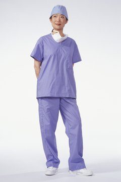 Surgeon wearing surgical gown, posing in studio, portrait