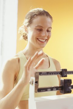 Duncan Smith/Digital Vision/Getty Images Creating a modest caloric deficit can help you gradually lose weight and keep it off.