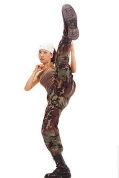 NA/Photos.com/Getty Images High kicks can be part of your warm up to improve flexibility.
