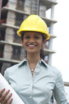 Comstock Images/Comstock/Getty Images Health and safety officers ensure the workplace is safe and functioning within government regulations.