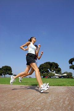 Goodshoot/Goodshoot/Getty Images Running on the ground works more muscles than running on a treadmill.