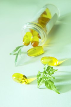 Hemera Technologies/AbleStock.com/Getty Images Fish oil capsules are loaded with DHA and EPA.