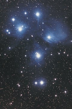 The Pleiades cluster in Taurus is visible during the winter.