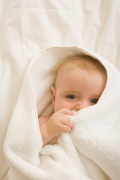 Jupiterimages/Pixland/Getty Images Having a baby means making changes to your insurance policies.