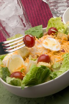 Jupiterimages/liquidlibrary/Getty Images If you're careful about cholesterol, hard-boiled eggs can be a healthy salad topping.