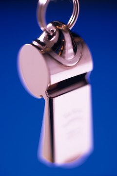 Jupiterimages/Creatas/Getty Images The whistle distracts your dog from barking while it's training her.