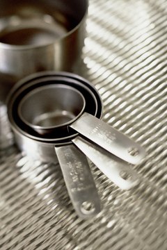 Hands-on use of measuring cups in the kitchen help with fractional concepts.