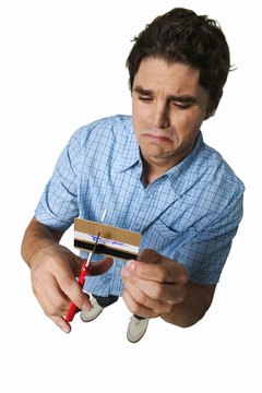 George Doyle/Stockbyte/Getty Images Both bankruptcy and defaulting on credit card debt hurt your credit score.