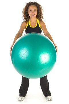 Jupiterimages/Photos.com/Getty Images An exercise ball can provide a little lift for your sagging sisters.