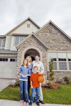 Jupiterimages/Comstock/Getty Images Lenders use your debt-to-income ratio as a key factor in determining how much house you can afford.