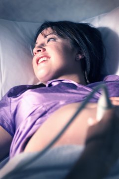 Photodisc/Photodisc/Getty Images Obstetric technicians provide mothers the joy of seeing their developing babies.