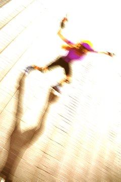 John Foxx/Stockbyte/Getty Images Include roller skating as part of your cardiovascular fitness routine.