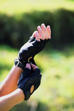 Thinkstock/Comstock/Getty Images Fingerless gloves are a popular style for weightlifters.