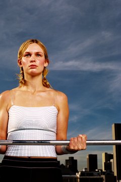Stockbyte/Stockbyte/Getty Images Biceps curl would be paired with a triceps exercise in an antagonistic workout.