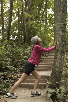 Thomas Northcut/Photodisc/Getty Images Relax and breathe evenly for a more effective calf stretch.