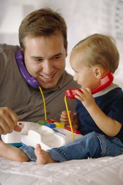 Play games with your toddler using age-appropriate toys that stimulate and encourage him.