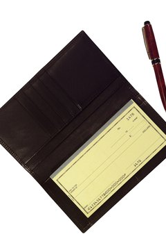 Brand X Pictures/Brand X Pictures/Getty Images The numbers on a check tell you where it is supposed to go.