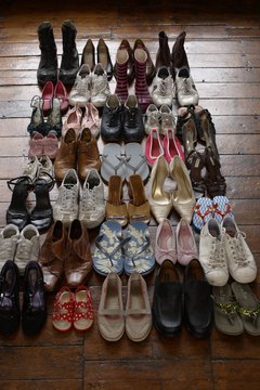 shoes neatly organised on wooden floor