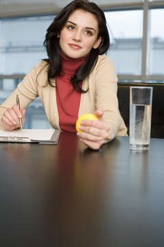 Creatas Images/Creatas/Getty Images Work your forearms while pretending to pay attention to the meeting.