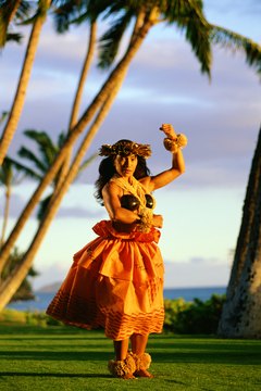 Thinkstock/Comstock/Getty Images Tahitian dance uses the core muscles of the waist.