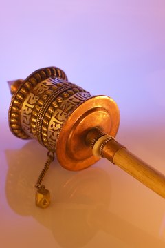This small Tibetan prayer wheel has the words of a prayer embossed on its surface.