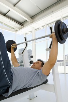 Pixland/Pixland/Getty Images Lifting weights helps with weight loss.